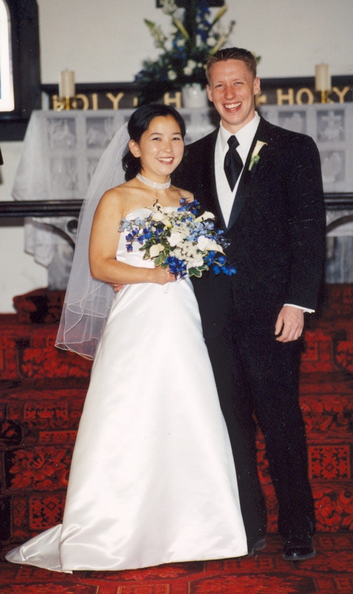 Jake and Mariko posed at the altar, in color